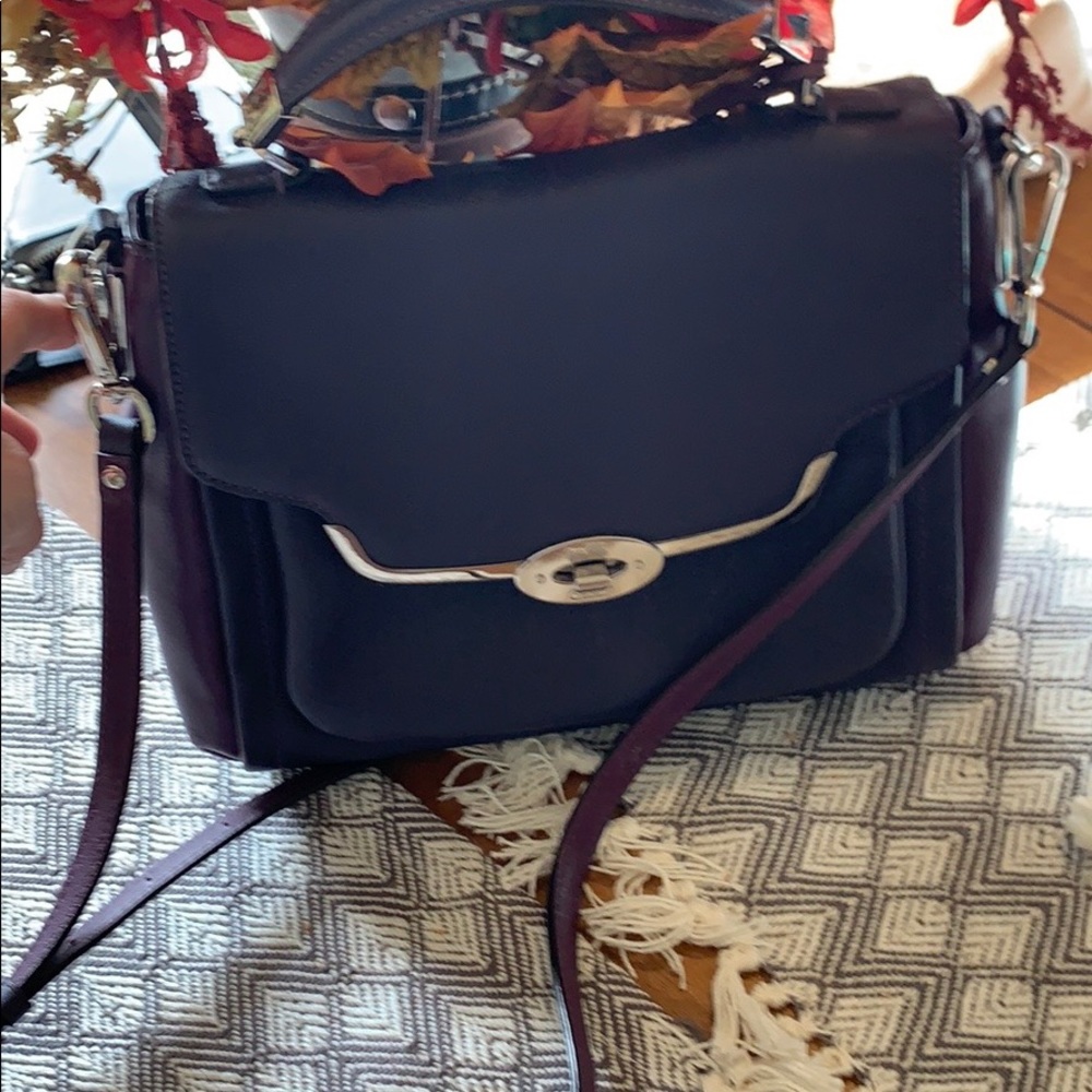 NWOT Authentic Coach leather Purse purple in color silver. NWOT